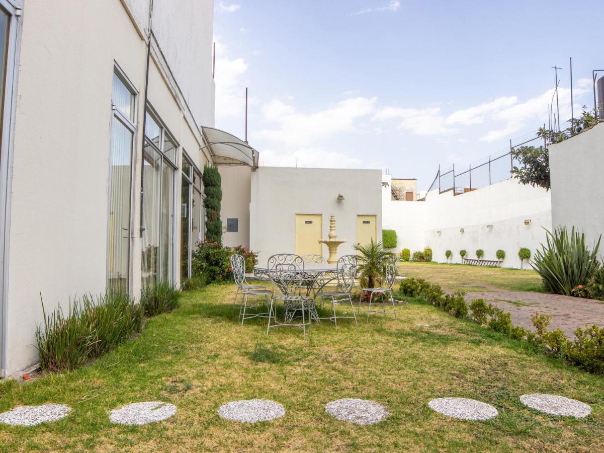بويبلا Capital O Hotel Villa Monini المظهر الخارجي الصورة